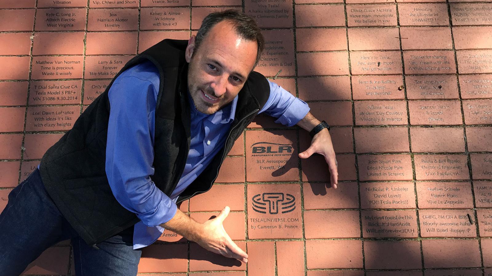 Cameron Prince with Tesla Universe brick at Wardenclyffe
